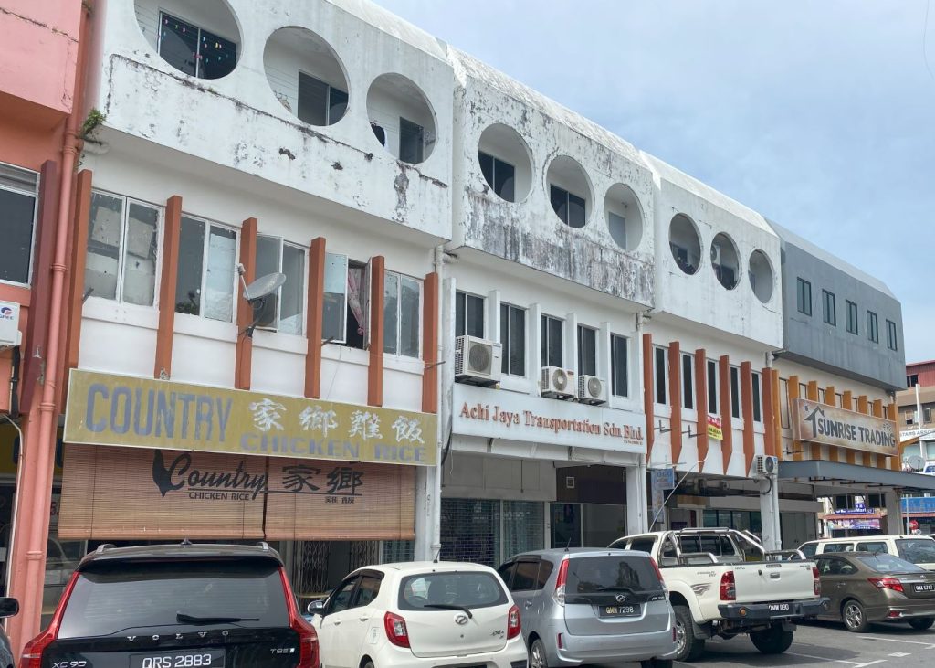 Street view of Miri, showcasing buildings with a mix of modern and traditional architecture.