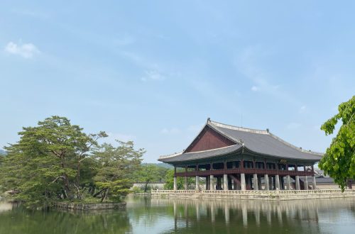 A historical building sits at the edge of a lake in Seoul, South Korea.