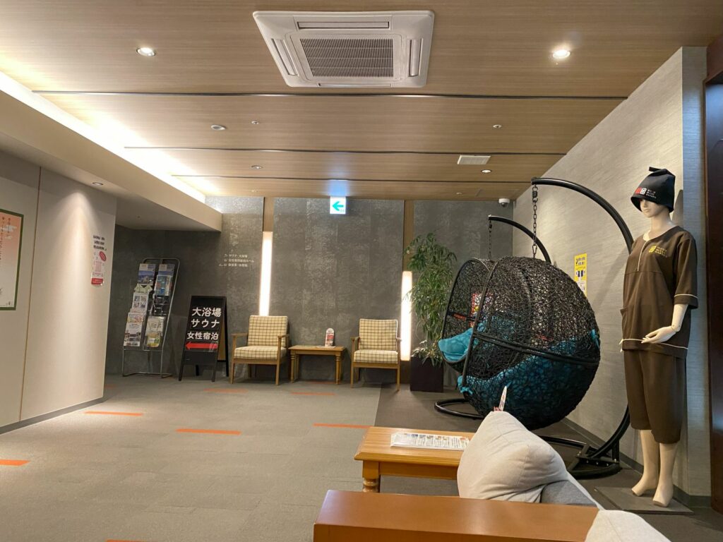 Interior lobby area of Good Bless Garden capsule hotel in Yonago, Japan.