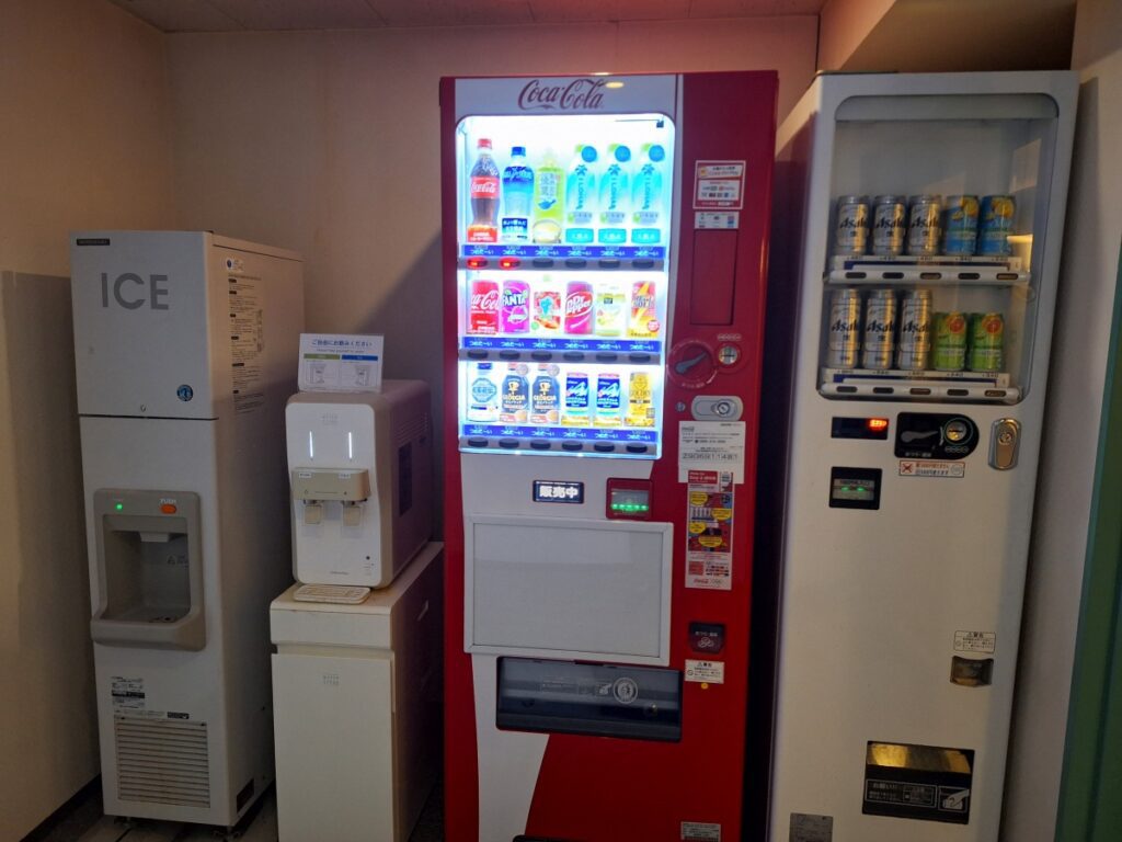 A water station with free filtered water and an ice machine available for guests.